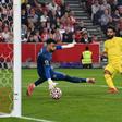 Mohamed Salah (C) scores for Liverpool in a 3-3 Premier League draw at Brentford