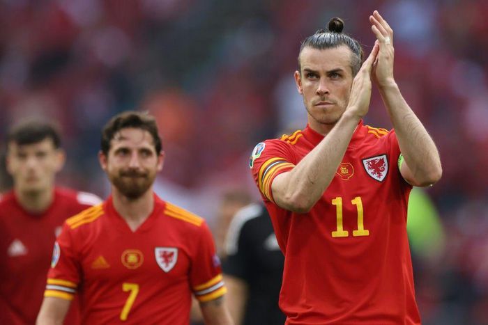 Gareth Bale (right) has pledged to continue leading Wales as captain