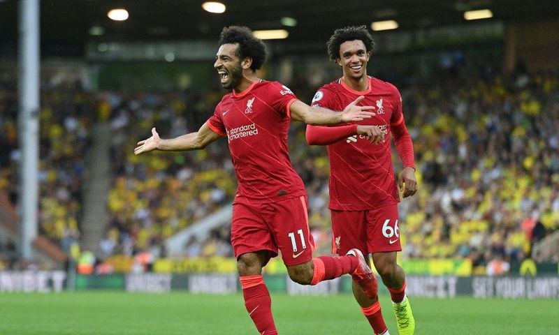 Mohamed Saleh (L) celebrates his goal for Liverpool at Norwich on the opening weekend of the English Premier League season