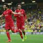 Mohamed Saleh (L) celebrates his goal for Liverpool at Norwich on the opening weekend of the English Premier League season