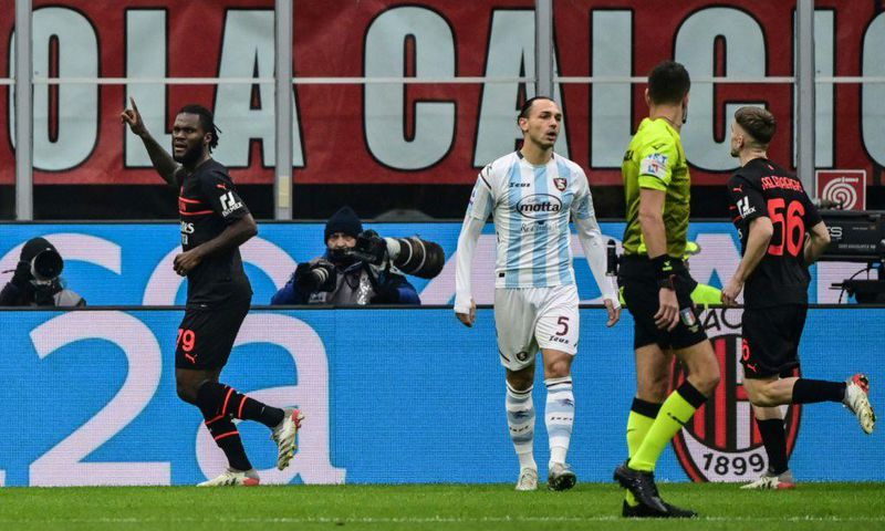 Franck Kessie (L) celebrates after scoring the opening goal for AC Milan