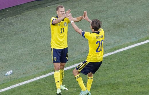 Viktor Claesson (L) celebrates his late winner against Poland
