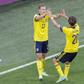 Viktor Claesson (L) celebrates his late winner against Poland