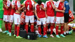 Denmark's players formed a protective ring around Christian Eriksen after he suffered a cardiac arrest in their opening match of Euro 2020 against Finland