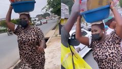 Sista Afia takes over street hawker's job in traffic; gives out free water, drinks