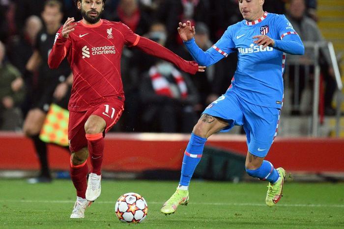 Egypt captain Mohamed Salah (L) playing for Liverpool against Atletico Madrid in the Champions League at Anfield.