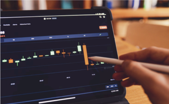https://unsplash.com/photos/a-person-using-a-laptop-computer-with-a-chart-on-the-screen-InWI1lteYf U