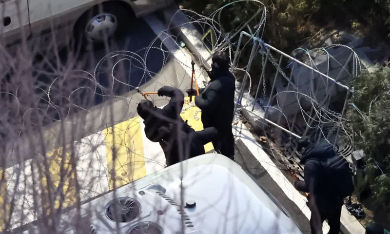 Investigators scale walls, cut barbed wire, arrest South Korea’s President