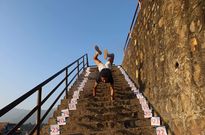 4. Fastest 50m walking on hands with a football between the legs