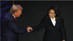 Former U.S. President Donald Trump and U.S. Vice President Kamala Harris shake hands as they attend a presidential debate. REUTERS/Brian Snyder