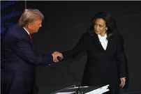 Former U.S. President Donald Trump and U.S. Vice President Kamala Harris shake hands as they attend a presidential debate. REUTERS/Brian Snyder