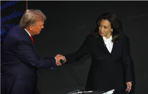 Former U.S. President Donald Trump and U.S. Vice President Kamala Harris shake hands as they attend a presidential debate. REUTERS/Brian Snyder