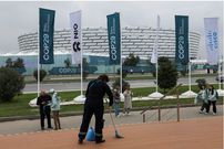 A person cleans on the day of the United Nations climate change conference COP29, in Baku. REUTERS/Murad Sezer