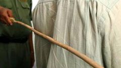 A person receiving strokes of cane [Tribune Online]