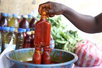Palm oil seller [Africa Is a Country]