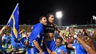 Curaçao players and fans celebrate World Cup 2026 qualification after a 0-0 draw with Jamaica at the National Stadium in Kingston, Jamaica on November 18, 2025. (AFP Photo)