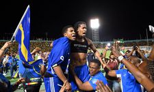 Curaçao players and fans celebrate World Cup 2026 qualification after a 0-0 draw with Jamaica at the National Stadium in Kingston, Jamaica on November 18, 2025. (AFP Photo)