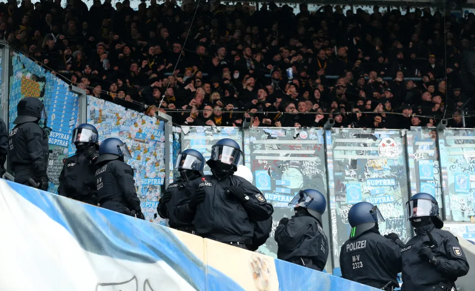 Chaos erupts, match suspended as riot police clash with fans in German league