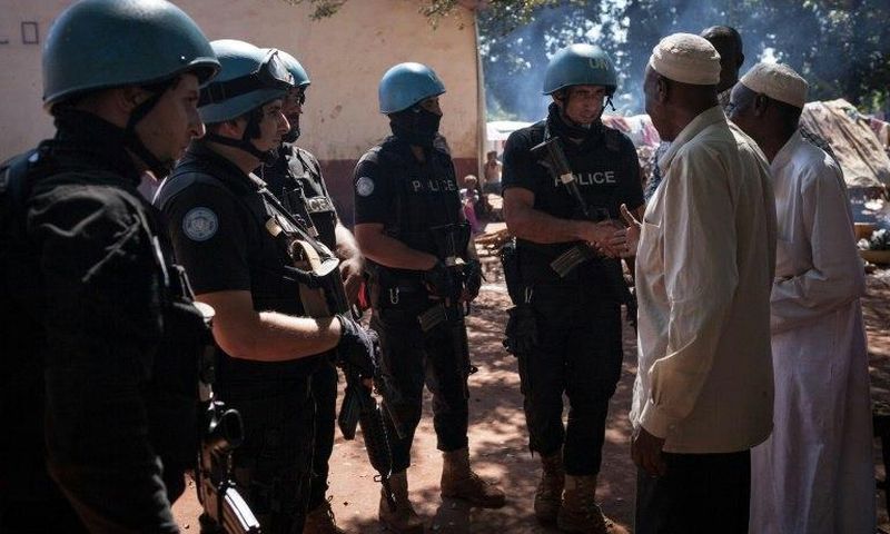 Jordanians peacekeepers meet Muslim refugees at an internally displaced persons camp in Bangassou on October 25, 2017