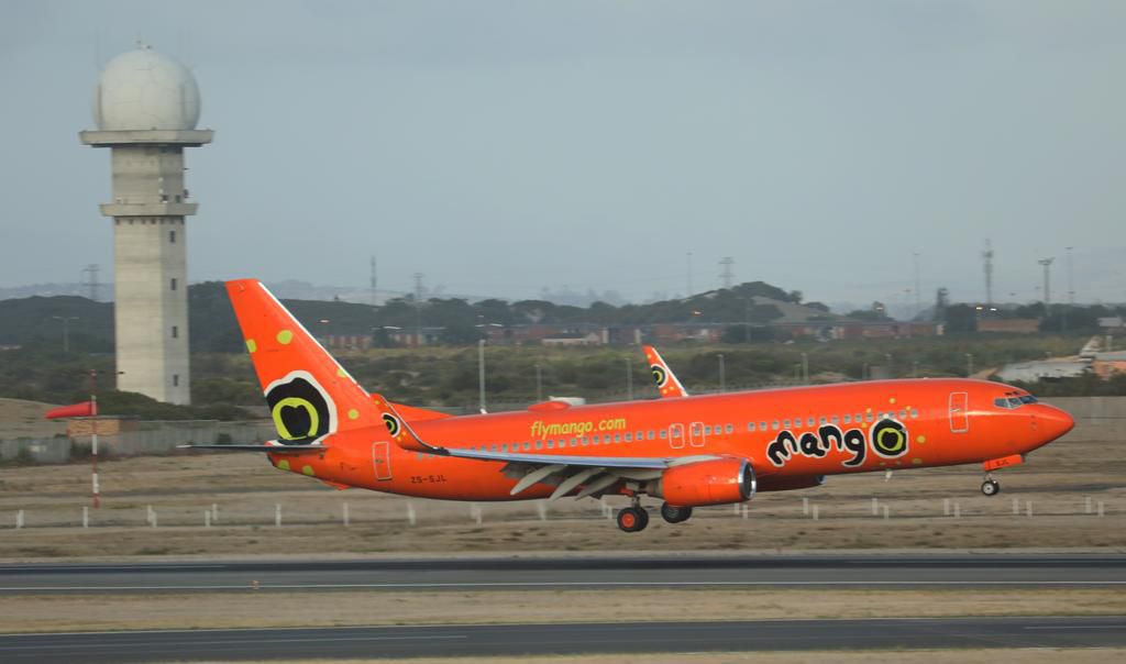 A Mango Boeing 737 passenger aircraft lands at Cape Town International airport in Cape Town.
