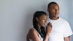 A man and woman embrace each other [Source: Essence]
