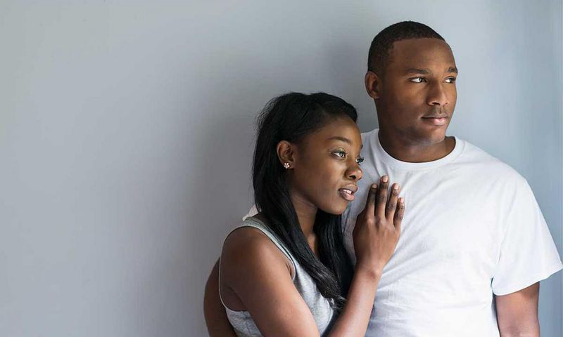 A man and woman embrace each other [Source: Essence]