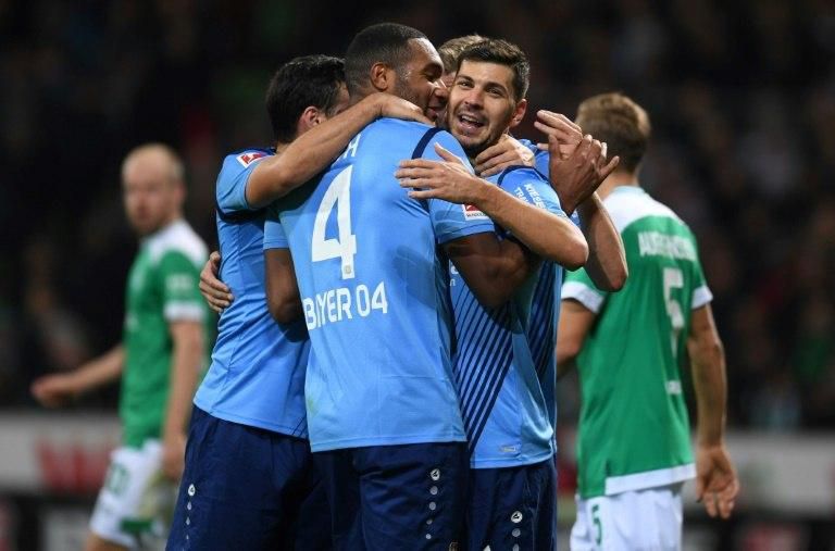 Leverkusen players celebrate during their 6-2 thrashing of Werder Bremen on Sunday to earn their first league win since late September and ease the pressure on head coach Heiko Herrlich.