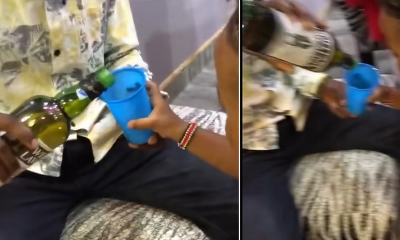 Screenshots from a video which circulated online showing an adult giving whiskey to a 3-year-old child.
