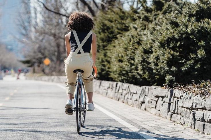 Cyclist riding bicycle on a city street [Photo: Blue Bird]