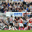 Mesut Ozil (second right) scores Arsenal's second goal in a 2-1 win away to Newcastle in the English Premier League on Saturday