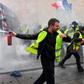Yellow Vests protesters clash with riot police forces during a demonstration against rising oil prices and living costs in Bordeaux, southwestern France, on December 1, 2018