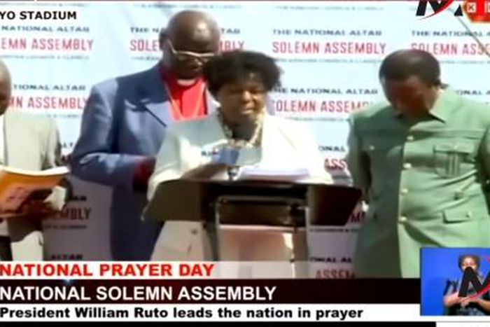 Pastor Sally praying at Kenya's National Prayer Service