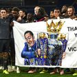 Leicester players hold a banner in honour of late owner Vichai Srivaddhanaprabha after their Premier League win against Cardiff