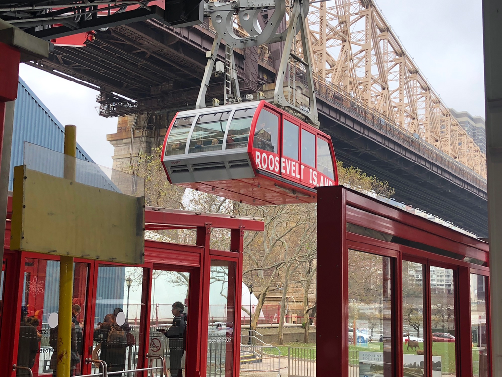One of New York City's most affordable tourist experiences is a tram that takes you 250 feet above the city for the price of a subway fare
