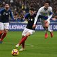 France defender Benjamin Pavard (C) vies with Uruguay forward Edinson Cavani during a November 20 friendly at the Stade de France.