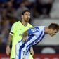 Watch this! Barcelona's Lionel Messi looks on as Leganes defender Raul Garcia clears the ball