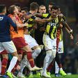 Fenerbahce and Galatasaray players fight at the end of the Turkish Spor Toto Super league fotball match between Galatasaray and Fenerbahce