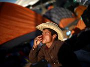 Powerful photos and stories from the caravan show migrants' harrowing journey to the US