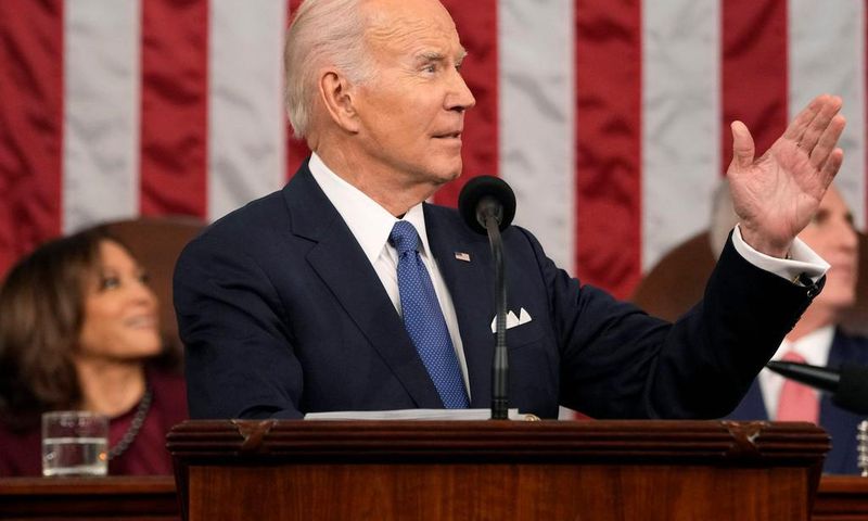 President Joe Biden gestures toward first lady Jill Biden as he delivers the State of the Union address to a joint session of Congress on February 7, 2023 in the House Chamber of the U.S. Capitol in Washington, DC. The speech marks Biden's first addres...