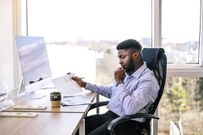 man working at desk in office