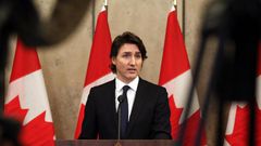Canada's Prime Minister Justin Trudeau speaks with reporters during a news conference on Parliament Hill February 11, 2022 in Ottawa, Canada.
