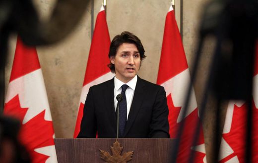 Canada's Prime Minister Justin Trudeau speaks with reporters during a news conference on Parliament Hill February 11, 2022 in Ottawa, Canada.