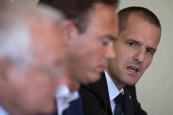 Cornel Borbely (R) give a press conference after FIFA's decision to remove its ethics team in 2017