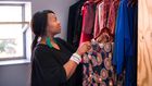 A woman arranging her wardrobe