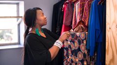 A woman arranging her wardrobe