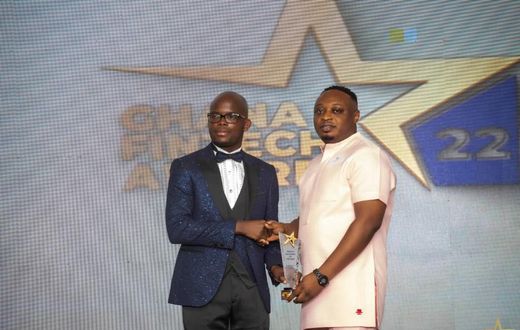 Frank Anwelle, Country Manager for DPO Pay receiving the award from Martin Kwame Awagah, organizer of the event