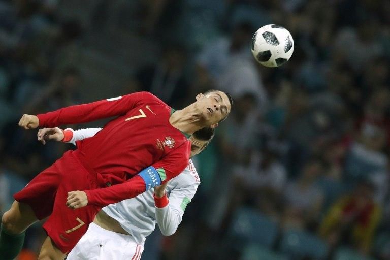 Cristiano Ronaldo heads the ball during Portugal's World Cup clash against Spain in Russia
