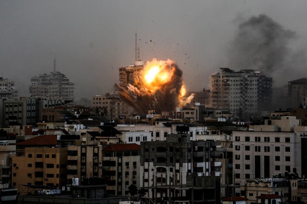 A smoke rises and a ball of fire over buildings in Gaza City on October 9, 2023, during an Israeli air strike.Sameh Rahmi/NurPhoto/Getty Images