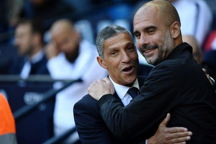 Pep Guardiola greets Brighton manager Chris Hughton prior to Manchester City's 2-0 win at home to the Seagulls on Saturday