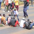 Protesters stage a sit-in along Thika Road demanding justice for the late Denzel Omondi who disappeared on June 25 and his body was later discovered in a Juja quarry [Image Credit: Tobiko Abraham]